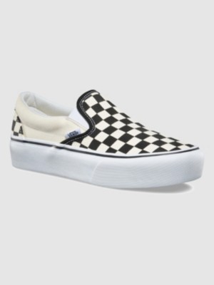 Light blue slip on vans with checkerboard outlet stripe